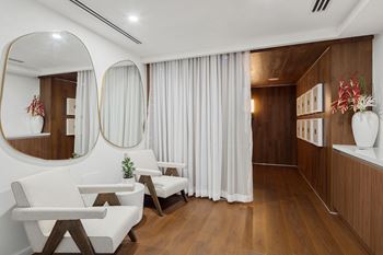 Spa relaxation room with modern chairs and mirrors